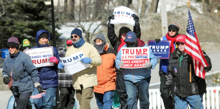 Trump supporters brave below-zero wind chill Saturday as they march toward the State House during a March 4 Trump rally in Augusta. The event was part of a nationwide show of support for President Donald Trump.