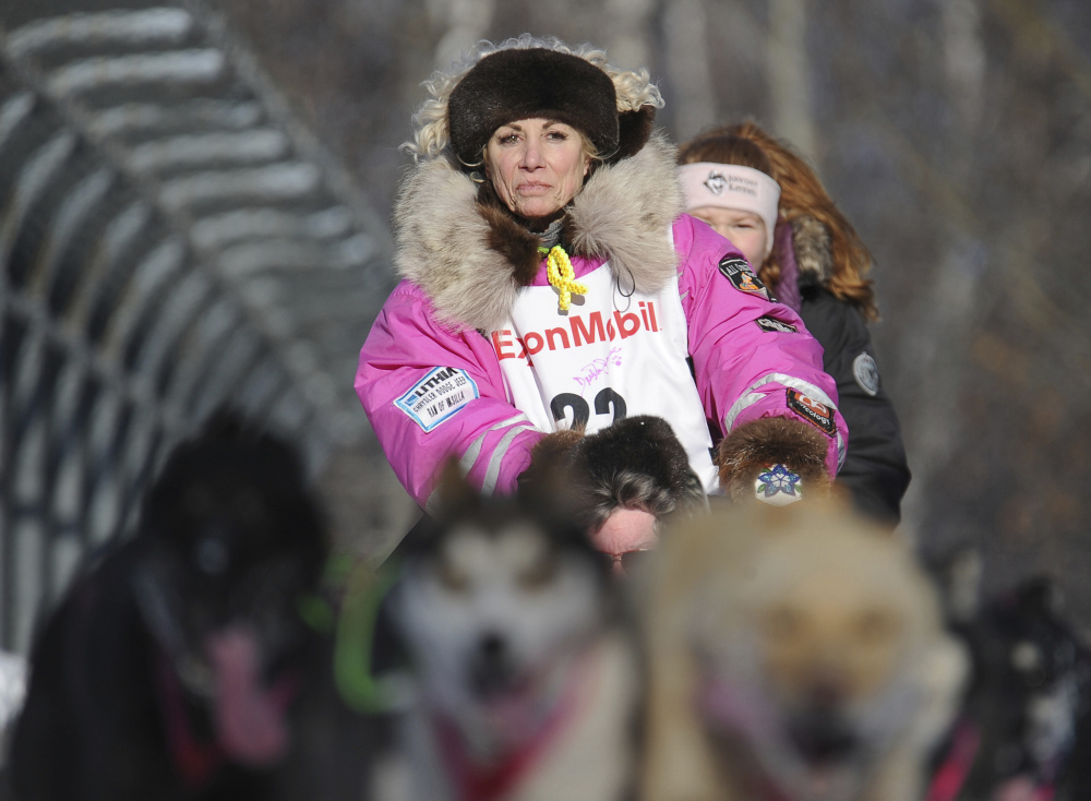 Dee Dee Jonrowe of Willow mushes during the ceremonial start of the Iditarod Trail Sled Dog Race in Anchorage, Alaska.