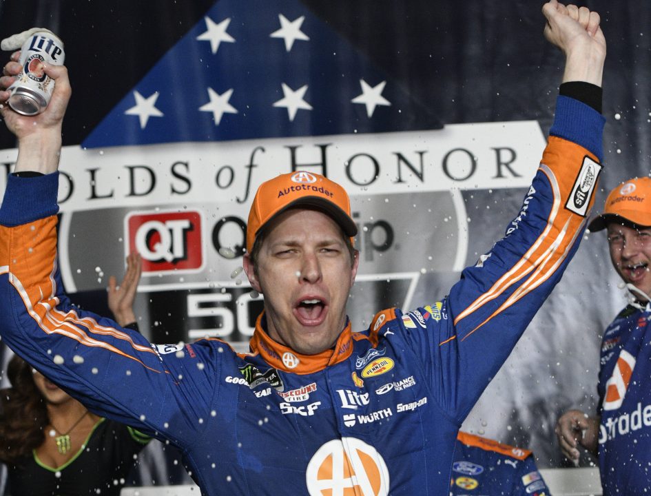 Brad Keselowski celebrates after his NASCAR Cup series victory Sunday at Atlanta Motor Speedway. Keselowski took the lead from Kyle Larson with six laps remaining, after Kevin Harvick was penalized for speeding.