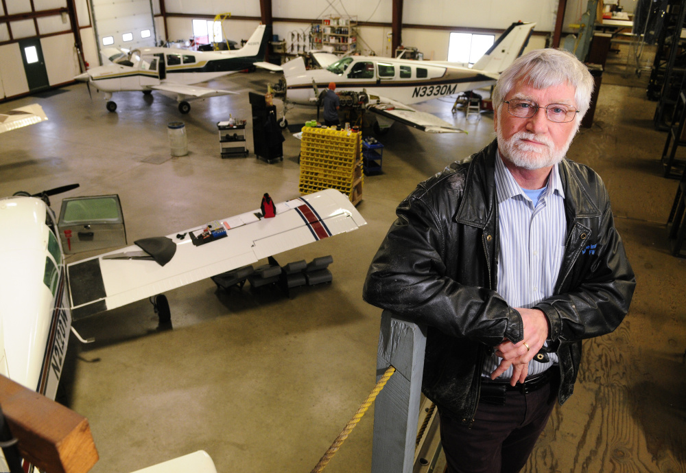 David Smith, who recently retired as chief pilot, poses for a photo in a hangar last week at Maine Instrument Flight in Augusta. Smith said that he still flies several charters a week but is done with administrative duties the chief's job entailed.