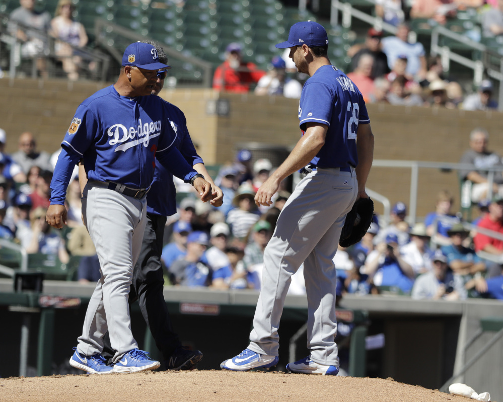 Los Angeles Dodgers manager Dave Roberts, seen at a spring training game in March, often gets credit for balancing the demands of the Dodgers’ data-driven front office and the hearts of the ballplayers.
