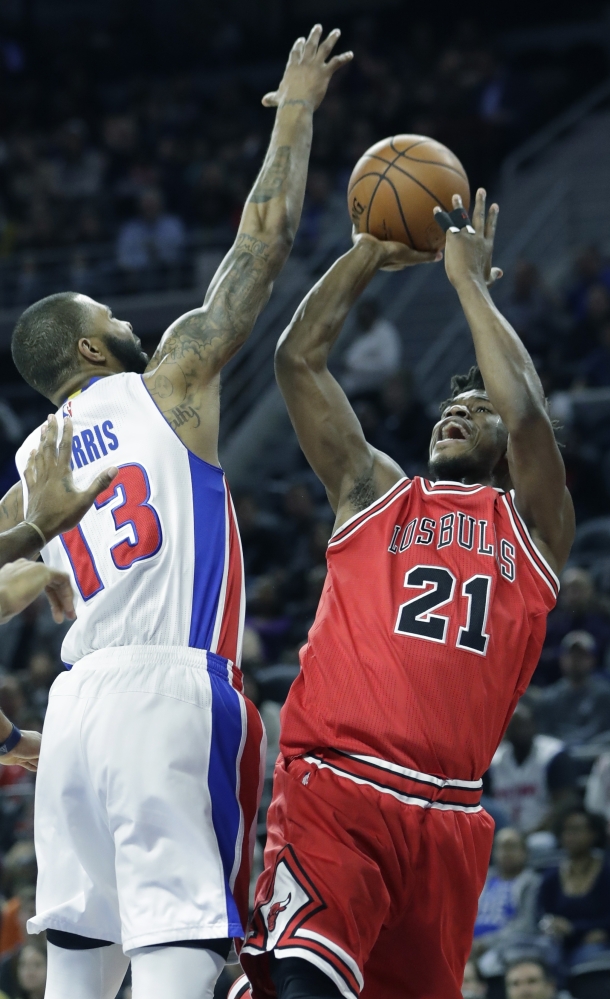 Chicago's Jimmy Butler takes a shot over Detroit's Marcus Morris during the Pistons' 109-95 win Monday in Auburn Hills, Michigan.