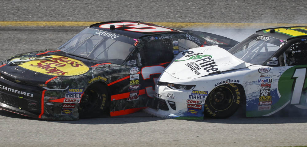Austin Dillon, left, put Denny Hamlin out of the XFinity race Saturday with this collision at Atlanta Motor Speedway in Hampton, Ga. A day later, Dillon seemed partly to blame for a yellow flag that likely cost Kevin Harvick a win.
