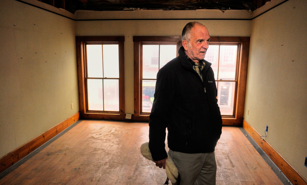 Terry Berry looks around Tuesday inside the Water Street building he recently bought in downtown Gardiner.