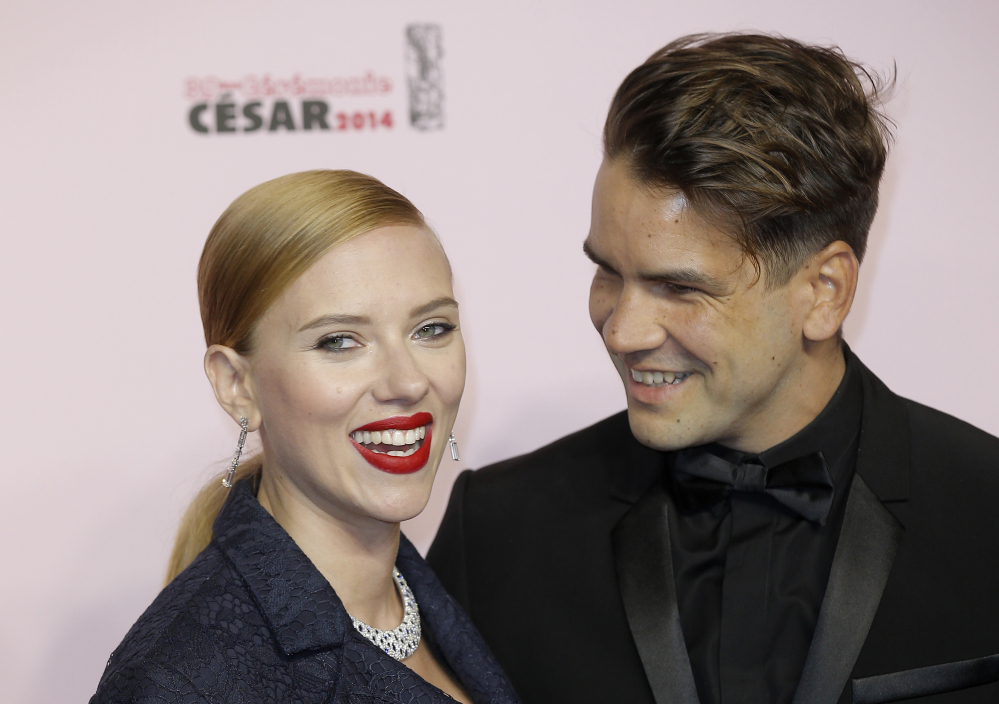 Actress Scarlett Johansson and her partner Romain Dauriac appear at an awards show. Johansson filed for divorce from Dauriac on March 7 in New York.