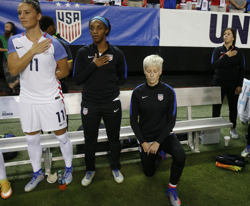Megan Rapinoe, while playing for the U.S. women's national soccer team, wouldn't stand for the anthem, but now says she'll abide by the federation's mandate to show respect.