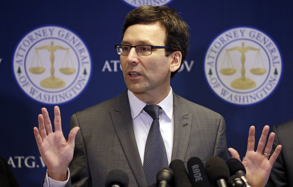Washington State Attorney General Bob Ferguson speaks at a news conference about the state's response to President Trump's revised travel ban Thursday in Seattle. Legal challenges against Trump's revised travel ban mounted Thursday as Washington state said it would renew its request to block the executive order. It came a day after Hawaii launched its own lawsuit, and Ferguson said both Oregon and New York had asked to join his state's legal action.