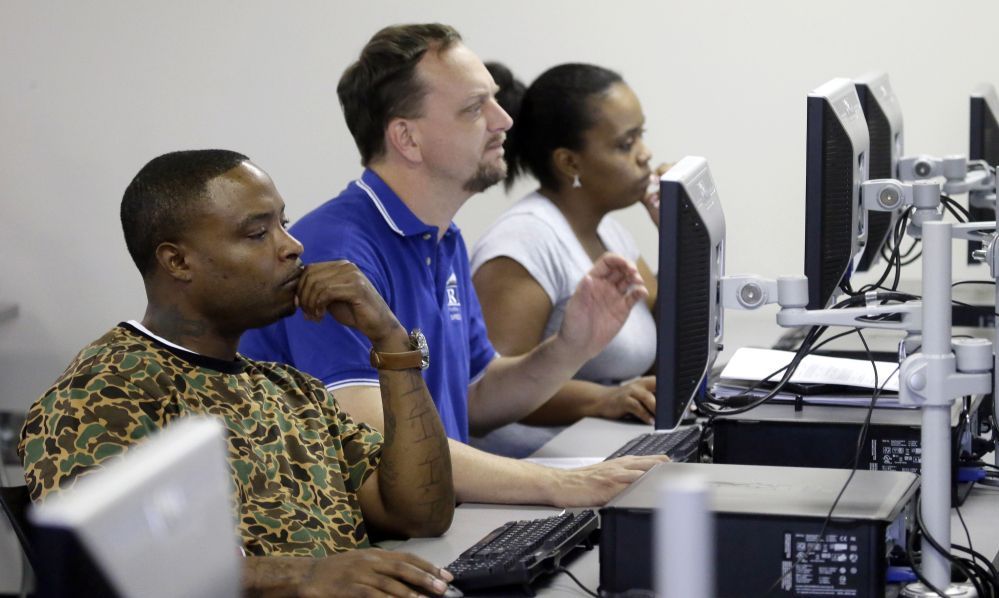 Job seekers look at their computer screens during a resume writing class at the Texas Workforce Solutions office in Dallas on Friday. U.S. employers added a robust 235,000 jobs in February.