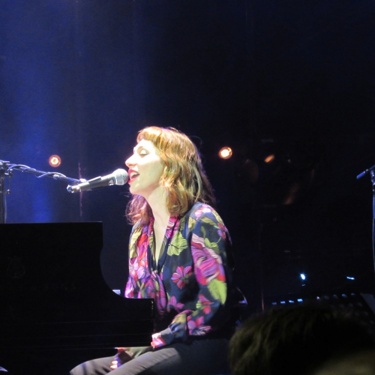 Regina Spektor performs at the State Theater in Portland on Thursday. She played the piano and sang songs from most of her albums, delighting a sold-out crowd.