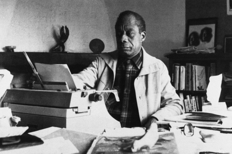 American writer James Baldwin poses in front of his typewriter in his house, March 15, 1983, Saint Paul de Vence, France. 