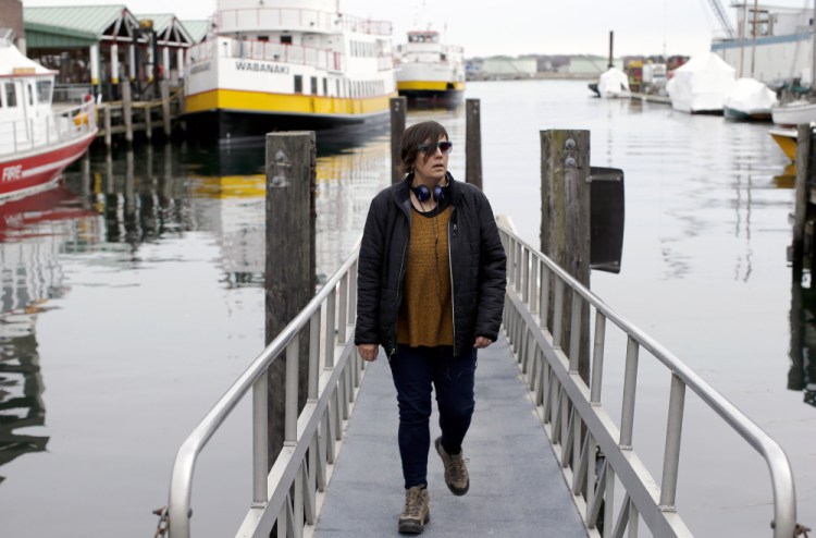 Aimsel Ponti checks out the water taxi ramp near Maine State Pier while on a walking jaunt in the Old Port.