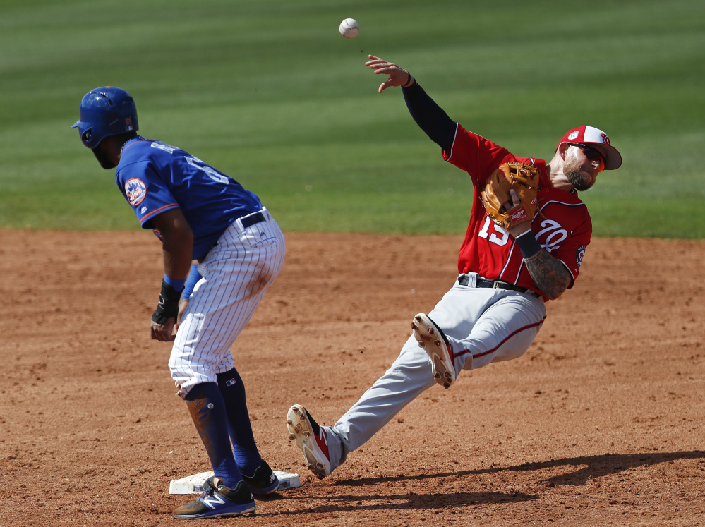Nationals second baseman Brandon Synder falls backward after forcing out the Mets' Amed Rosario on a grounder by Wuilmer Becerra in the fifth inning of Washington's 6-0 exhibition win Saturday at Port St. Lucie, Fla.