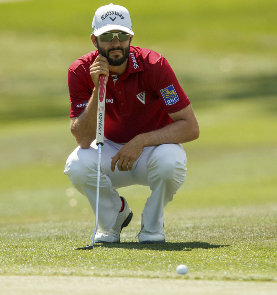 Adam Hadwin lines up a putt on the first hole Saturday during the third round of the Valspar Championship in Palm Harbor, Fla. Hadwin, winless in 77 career PGA Tour events, will take a four-stroke lead into the final round.