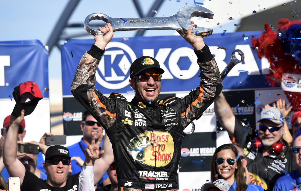 Martin Truex Jr. celebrates winning a NASCAR Cup Series race Sunday by raising an oversized wrench in Las Vegas. And speaking of a wrenching finish, Kyle Busch was wrecked in the last lap, then got a bloody forehead in a postrace brawl.