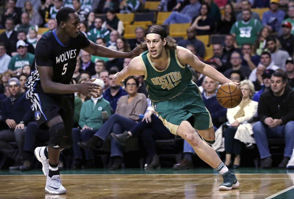 Celtics center Kelly Olynyk drives to the basket against Minnesota's Gorgui Dieng in the first quarter of Wednesday's game in Boston.
