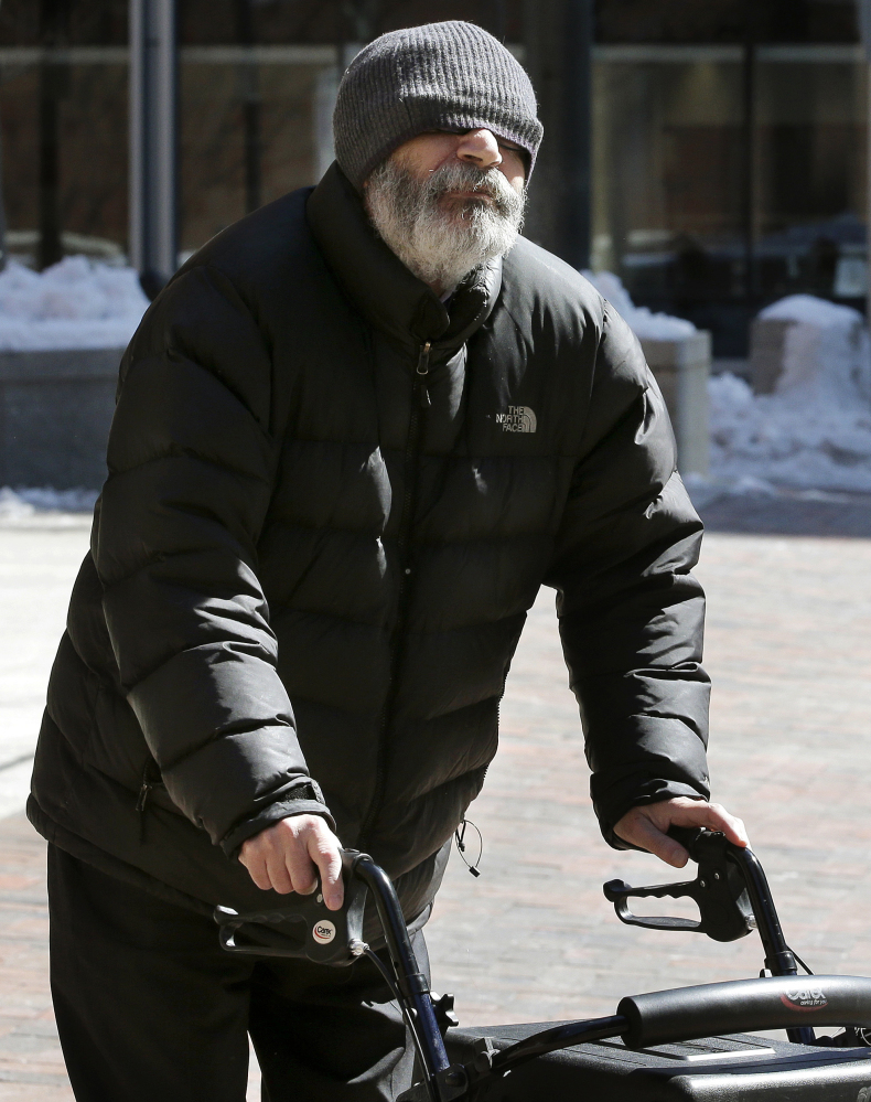 Dr. Fathalla Mashali leaves federal court in Boston on Wednesday after pleading guilty to multiple counts of health care fraud. Prosecutors said Mashali often saw more than 100 patients a day at his pain management clinics.