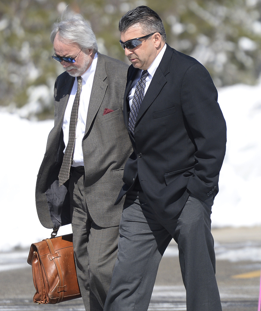Former Ogunquit town manager Thomas Fortier, right, enters court in York with attorney Bruce Merrill on Thursday. Fortier's case is headed for trial.