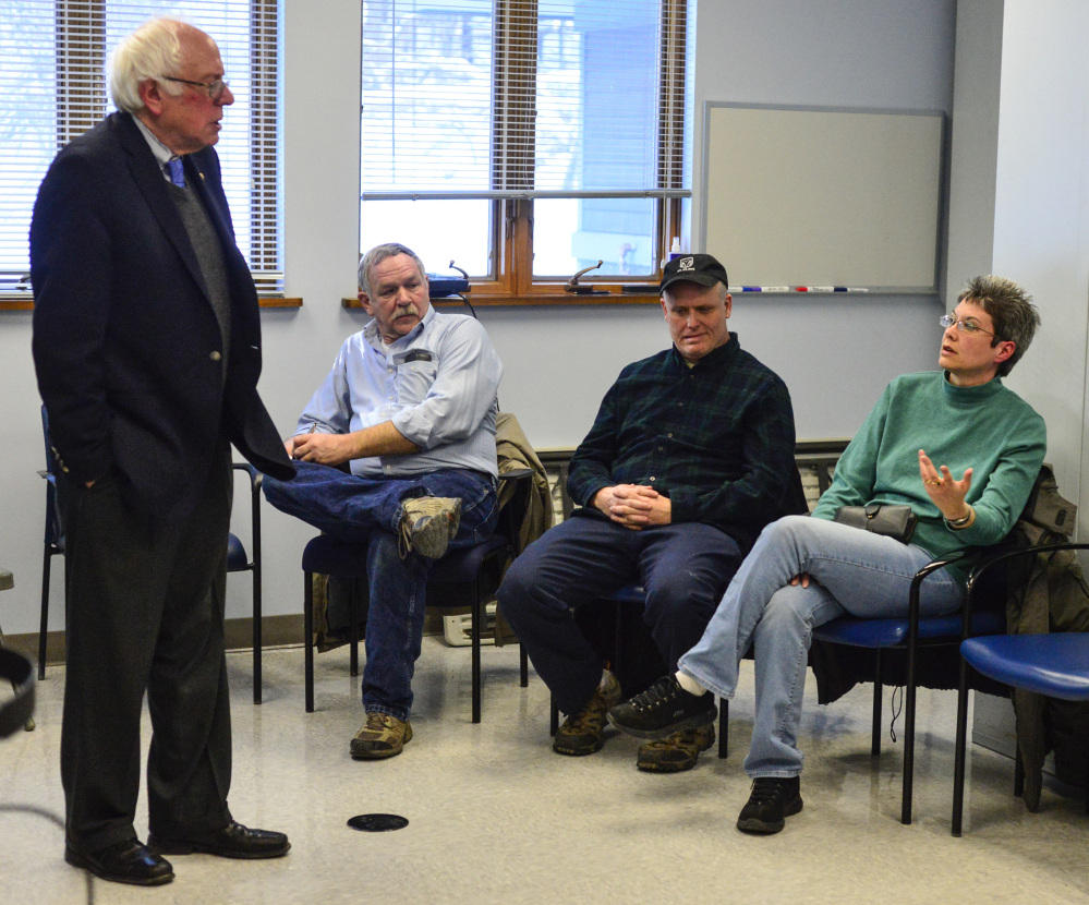 Lisa Lofting speaks about her concerns about women's health for veterans to U.S. Senator Bernie Sanders during a visit to the Brattleboro, Vt., VA., clinic on Thursday, Sanders urged Vermonters and all Americans to oppose President Trump's agenda.