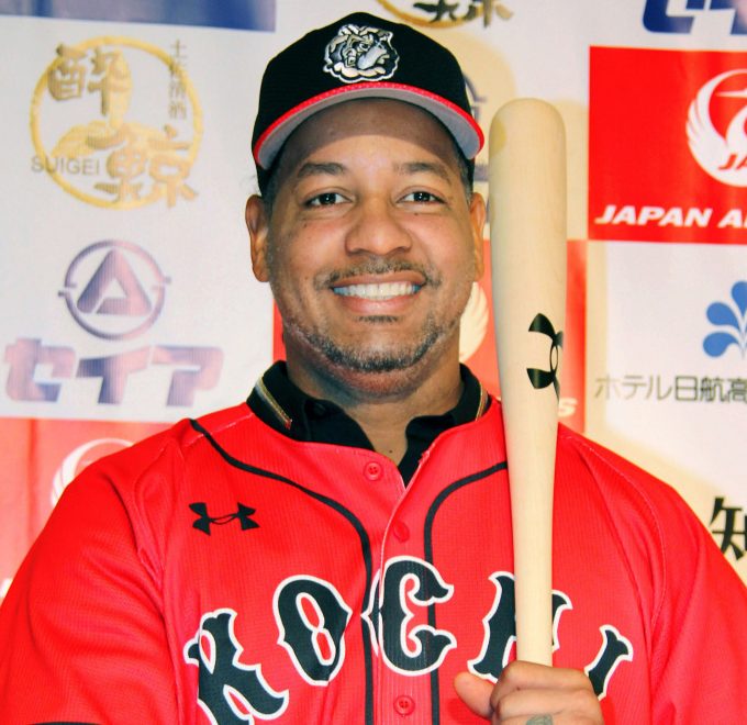 The uniform is red, but Manny Ramirez isn't with the Boston Red Sox. Now it's the Kochi Fighting Dogs.