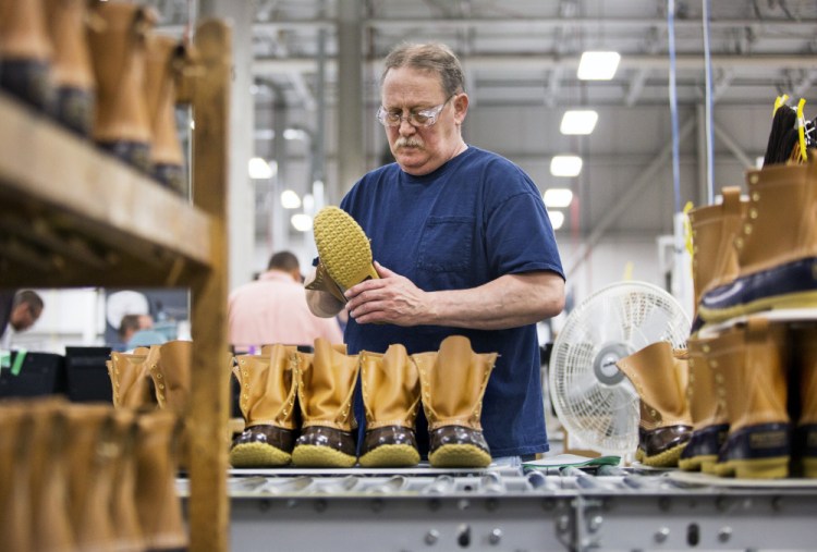 Jack Weaver assembles Bean boots at the L.L. Bean boot factory in Brunswick in September. Around 6,000 L.L. Bean employees will receive a 3 percent annual bonus based on sales at the outdoor gear retailer. The Freeport-based company announced Friday that its 2016 sales came in at just over $1.6 billion, similar to sales in 2015 and 2014.