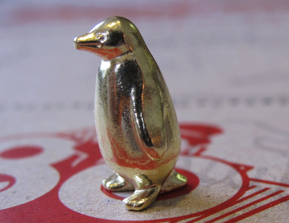 From left are the penguin, the rubby ducky and the T-Rex, three new tokens that will be included in upcoming versions of the board game Monopoly, in Atlantic City, N.J.