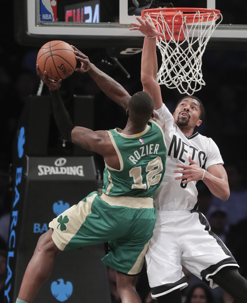 Boston's Terry Rozier goes up for a shot against Brooklyn's Spencer Dinwiddie in the second quarter Friday night in New York.