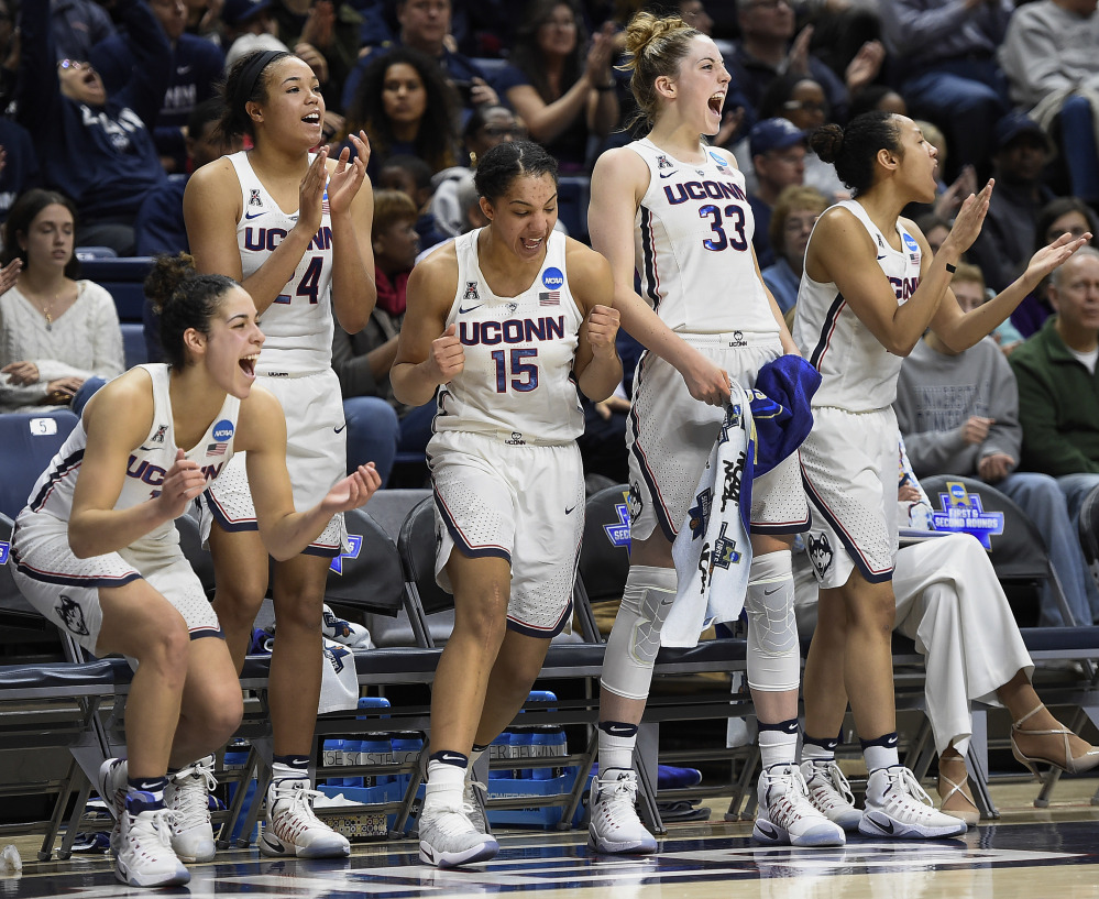 Connecticut's Kia Nurse, Napheesa Collier, Gabby Williams, Katie Lou Samuelson and Saniya Chong celebrate during the second half of their rout of Albany on Saturday.