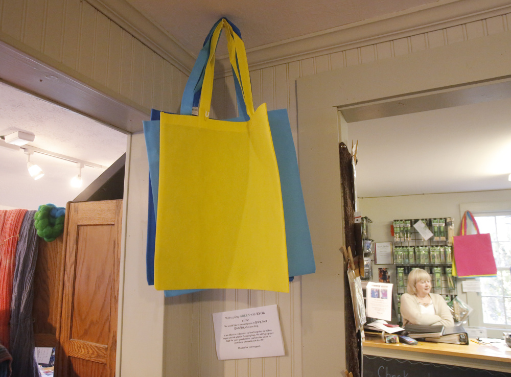 Reusable bags are offered for sale at The Yarn Sellar in York, which in 2015 became the first Maine community to ban the single-use plastic bags used by many businesses.