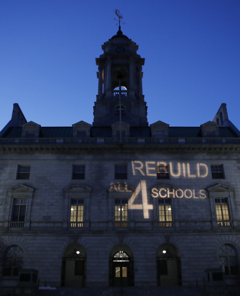 A light display intended to encourage city councilors to approve placing a $64 million school bond on the ballot is projected Monday on City Hall.