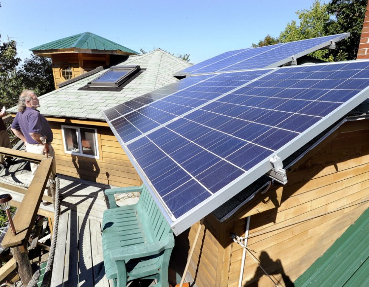 Michael Mayhew’s green home in Boothbay Harbor features many solar panels. A bill that aimed to prevent changes to the credits for solar panel owners passed the Maine House 105-40 and cleared the Senate 29-6 – both apparently veto-proof majorities.