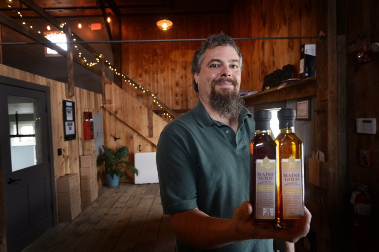 Scott Arndt of Maine Gold, pictured above, and David Woods, owner of Wiggly Bridge Distillery, are believed to be the first Mainers to jump on a trend that is spreading throughout the rest of New England: producing barrel-aged maple syrups.