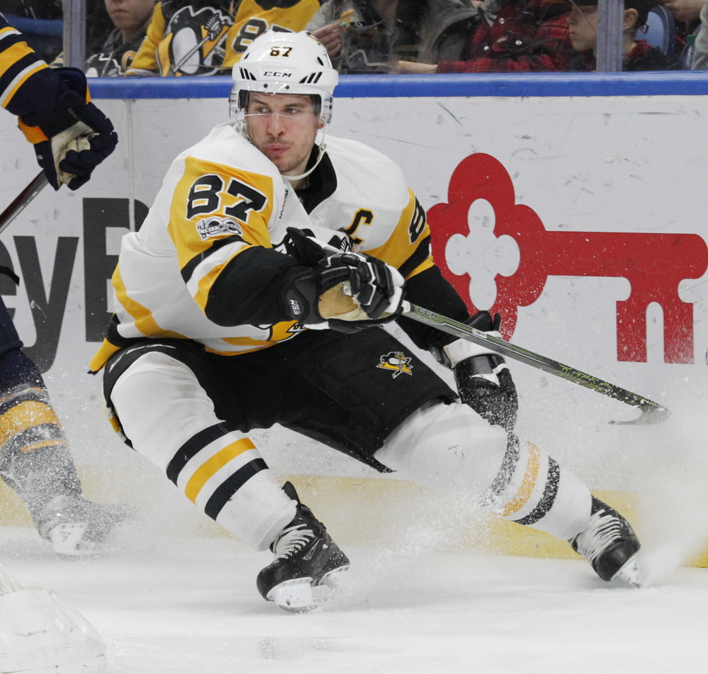 Penguins forward Sidney Crosby comes to a stop behind the net during the second period against Buffalo on Tuesday. Crosby scored a one-handed goal in Pittsburgh's 3-1 road win.