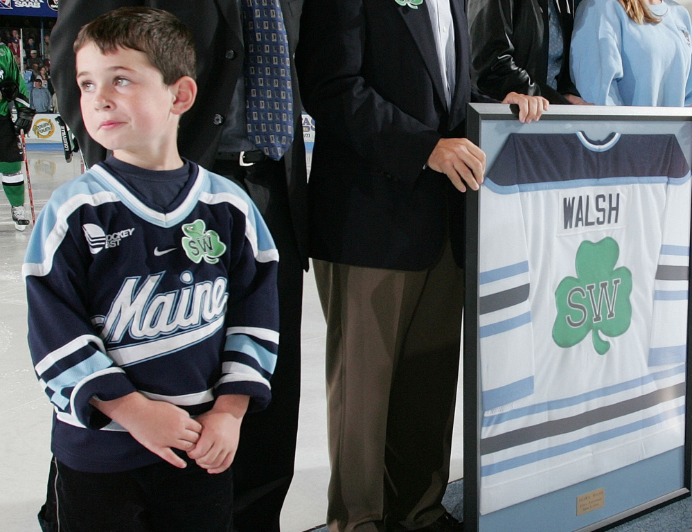 Sean Walsh was 5 years old during a 2004 ceremony at the University of Maine honoring his father's legacy. Now he will attend Canisius College before entering coaching.