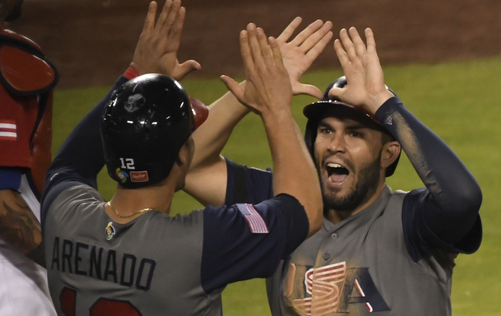 Eric Hosmer, left, and Nolan Arenado celebrate during the United States' 8-0 win over Puerto Rico in the 2017 World Baseball Classic on Wednesday.