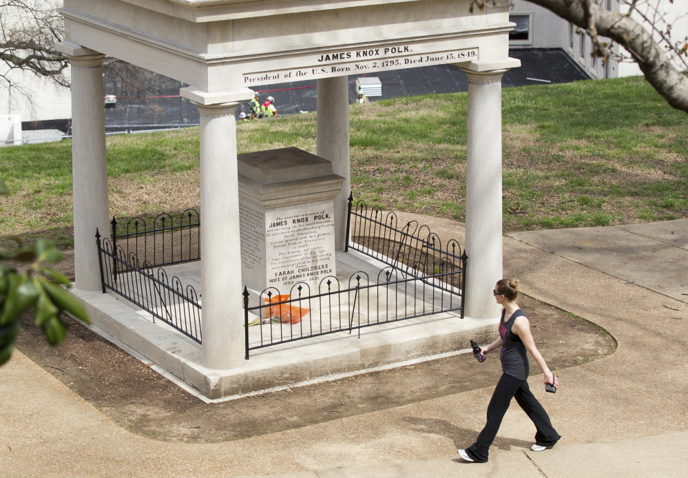 A visitor looks at the burial place of President James K. Polk and his wife, Sarah, on the grounds of the state Capitol in Nashville, Tenn. A resolution being considered in the state Legislature calls for exhuming their bodies and moving them to the James K. Polk Home and Museum in Columbia, Tenn.