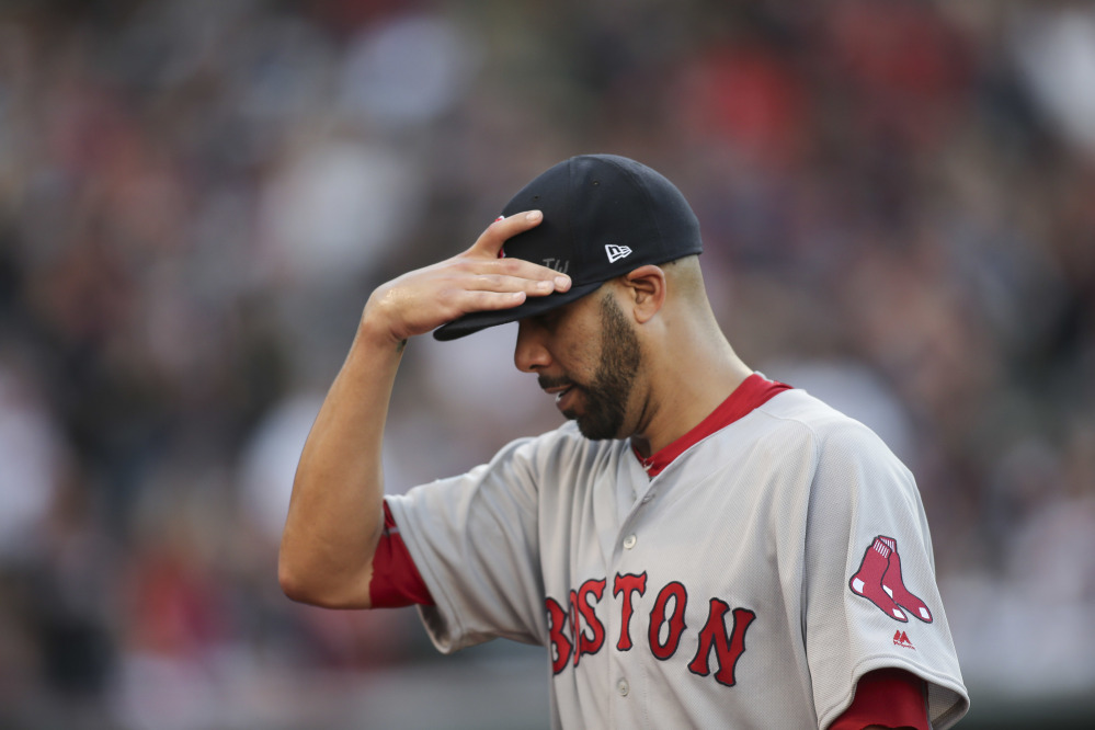 Boston Red Sox pitcher David Price walks off the field after being removed during the fourth inning against the Indians in Game 2 of an American League Division Series, on Oct. 7 in Cleveland. 