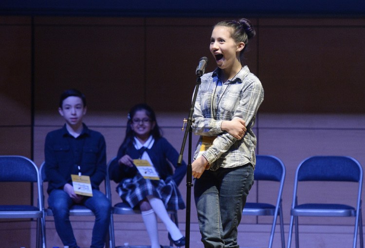 Naomi Zarin of the Friends School of Portland reacts after winning the Maine State Spelling Bee on Saturday. She correctly spelled the word "copal" in the 42nd round.