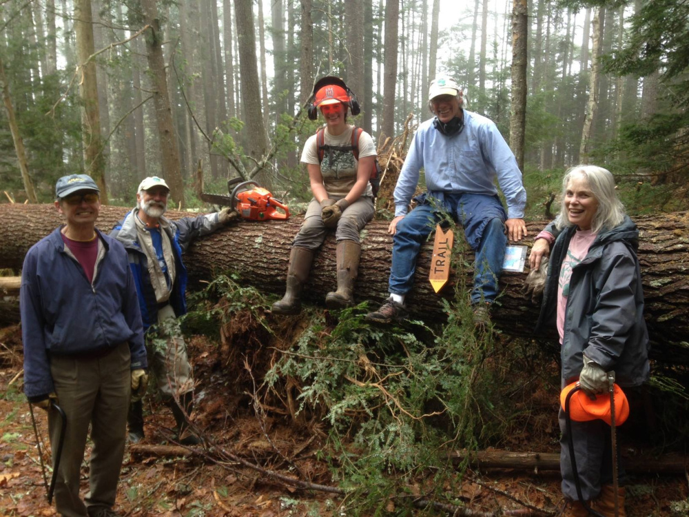 A volunteer crew for the Coastal Mountains Land Trust participates in field work at Fernalds Neck. The trust is now accepting registrations for two new volunteer training sessions it will offer in April.