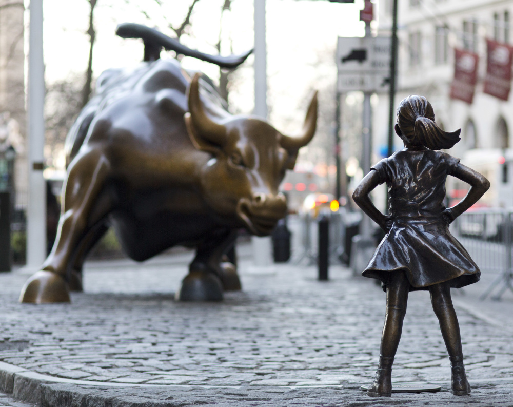 The "Charging Bull" and "Fearless Girl" statues stand on Lower Broadway in New York. The bull has stood as an image of the spirit of Wall Street.