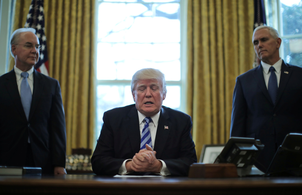 President Trump talks to journalists Friday after the Republican health care bill was withdrawn before a House vote. With him are Health and Human Services Secretary Tom Price, left, and Vice President Mike Pence.