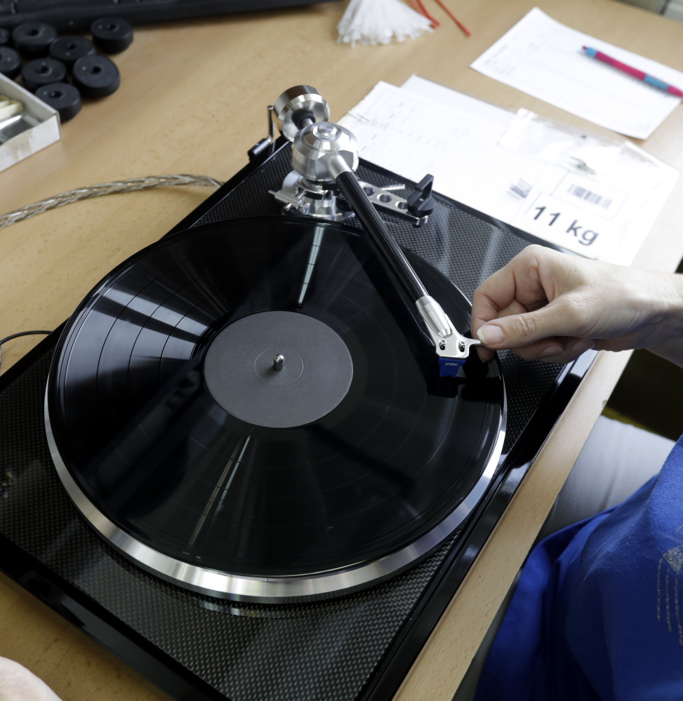 Playing records means you "listen to music relaxed," says an observer. "You don't click for the next song."