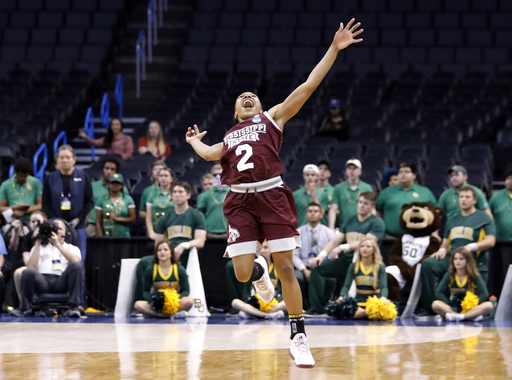 Mississippi State's Morgan William celebrates after the Bulldogs' 94-85 overtime win against Baylor in the regional final on Sunday. Next up: heavily favored Connecticut.