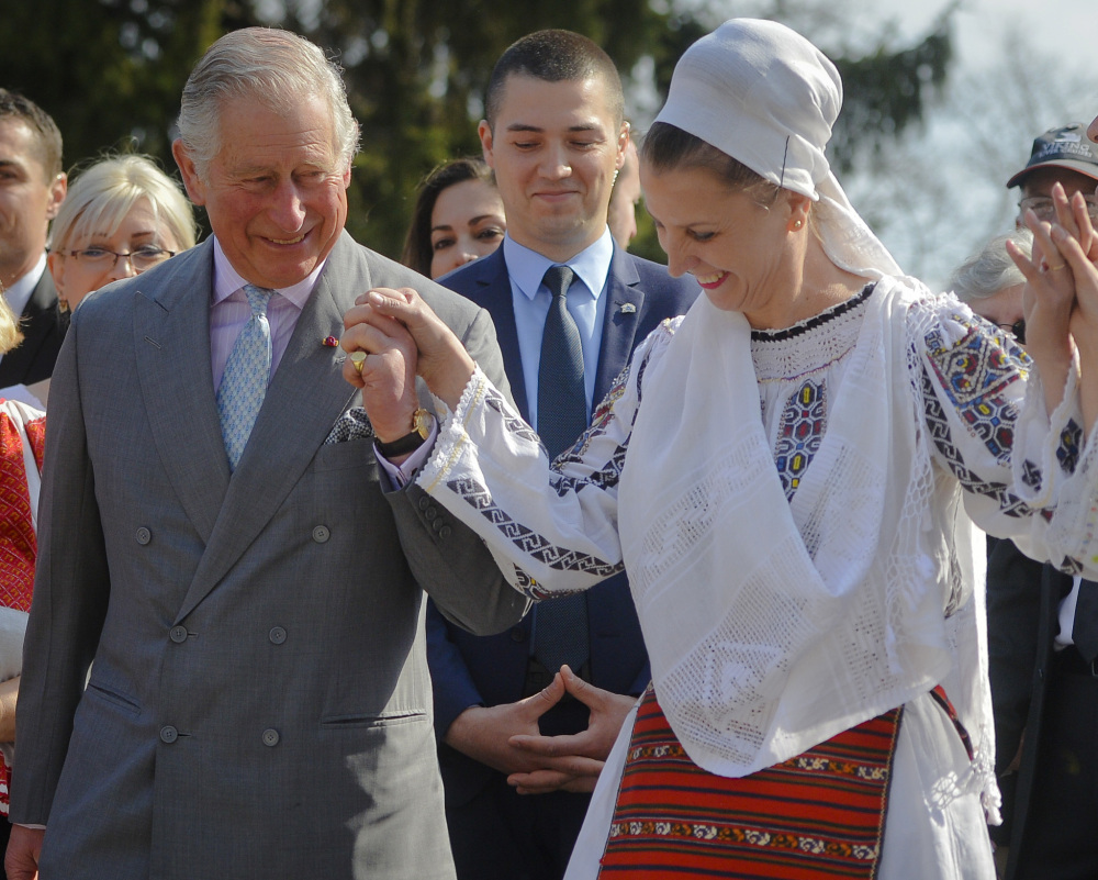 Britain's Prince Charles joins a traditional folk dance Thursday in Bucharest, part of an effort to reassure European Union nations that Britain remains an ally.