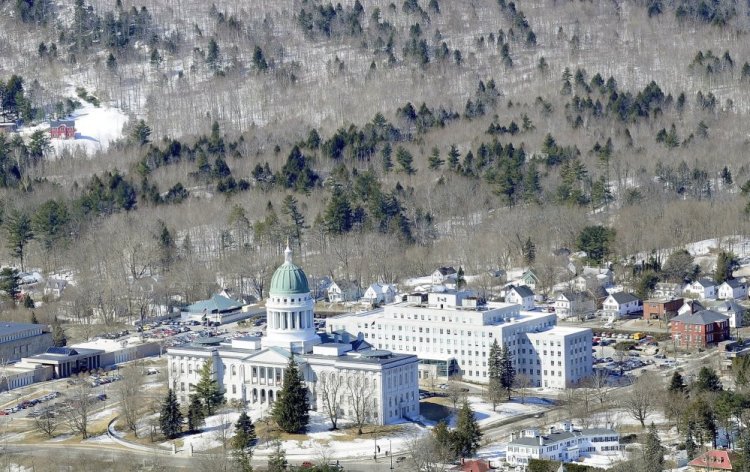 This aerial photo taken in March 2014 shows Howard Hill, 164 wooded acres that serve as a scenic forested backdrop to the State House in Augusta.