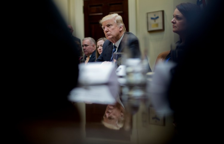 President Trump listens during a meeting on healthcare in the Roosevelt Room of the White House on March 13. 