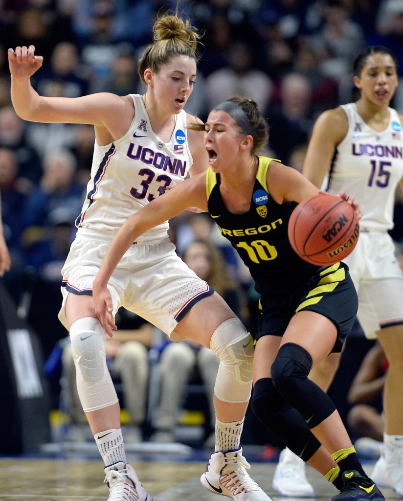 Connecticut's Katie Lou Samuelson defends against Oregon's Lexi Bando in the first half of Connecticut's 90-52 win.