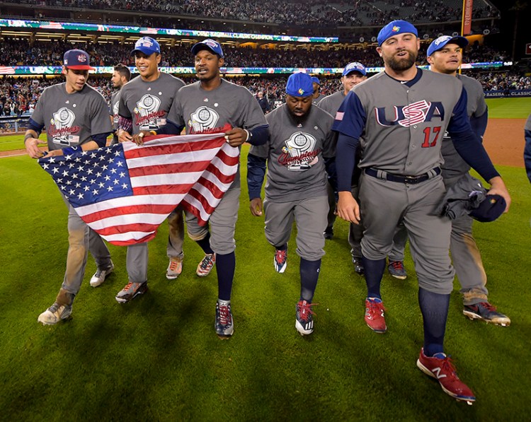 The U.S team celebrates an 8-0 win over Puerto Rico in the final of the World Baseball Classic in Los Angeles.