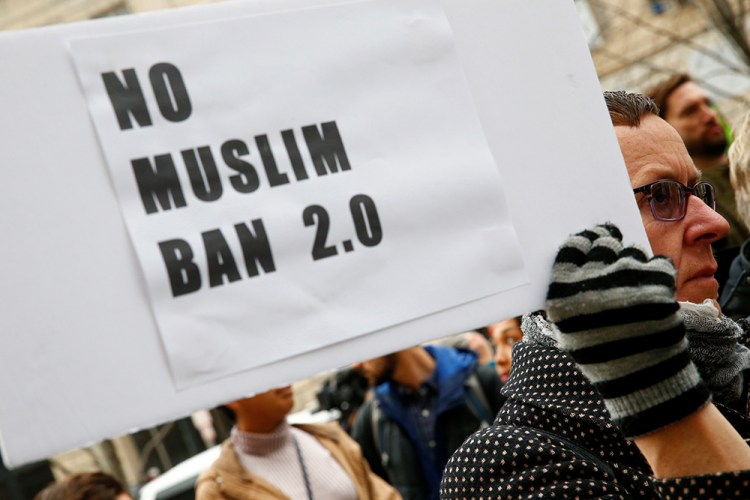 Immigration activists rally on March 7 against the Trump administration's revised ban against travelers from six Muslim-majority nations, outside of the U.S. Customs and Border Protection headquarters in Washington.