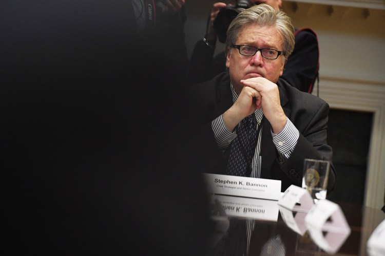 Stephen Bannon is seen as President Trump meets with business leaders in the Roosevelt Room of the White House on Jan. 23.  He may have made a serious misstep by crossing swords with the president's son-in-law, Jared Kushner.