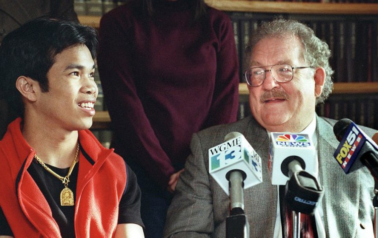 Dan Lilley shares Seiha Srey's elation at a March 2000 news conference after murder and other charges against Srey were dropped in a high-profile case involving a killing outside Denny's in Portland.
